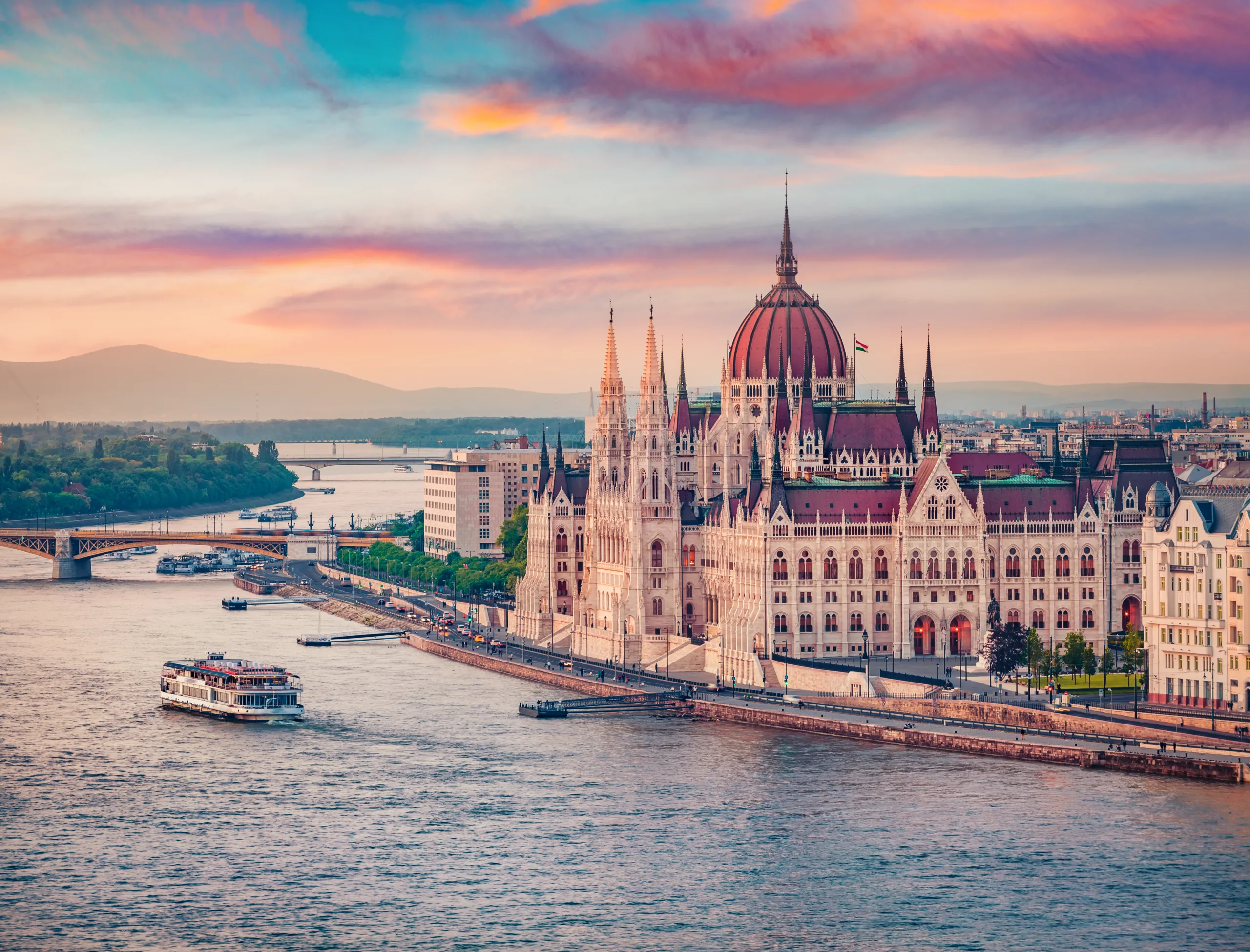 Amazing evening view of Parliament house and river cruise Stunning spring cityscape of Budapest