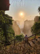 Traveller in front of Victoria Falls day 18, South Africa & Victoria Falls Approach Tour