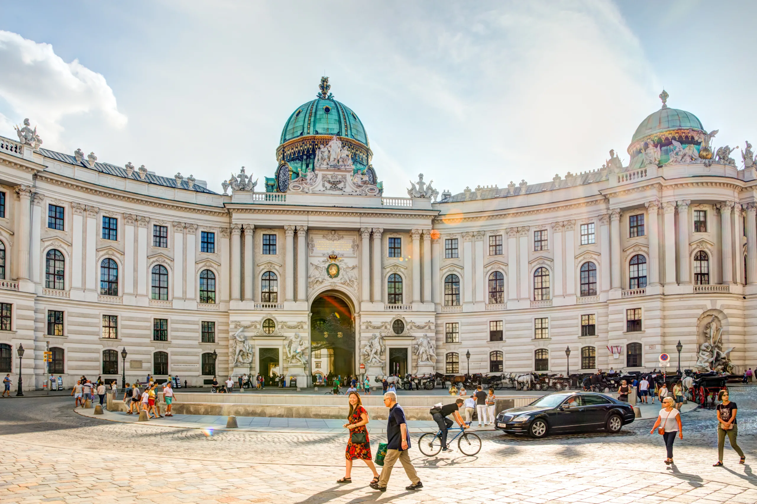 Tourists at the famous imperial Hofburg palace in Vienna, Austria
