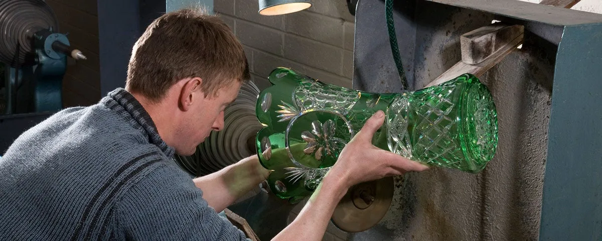 Man working on a vase in the Celtic Crystal factory