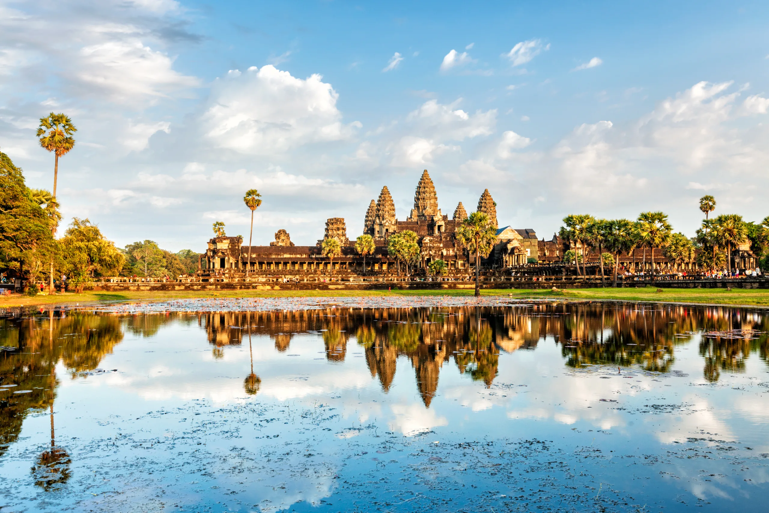 Cambodian Landmark Angkor Wat With Reflection In Water On Sunset